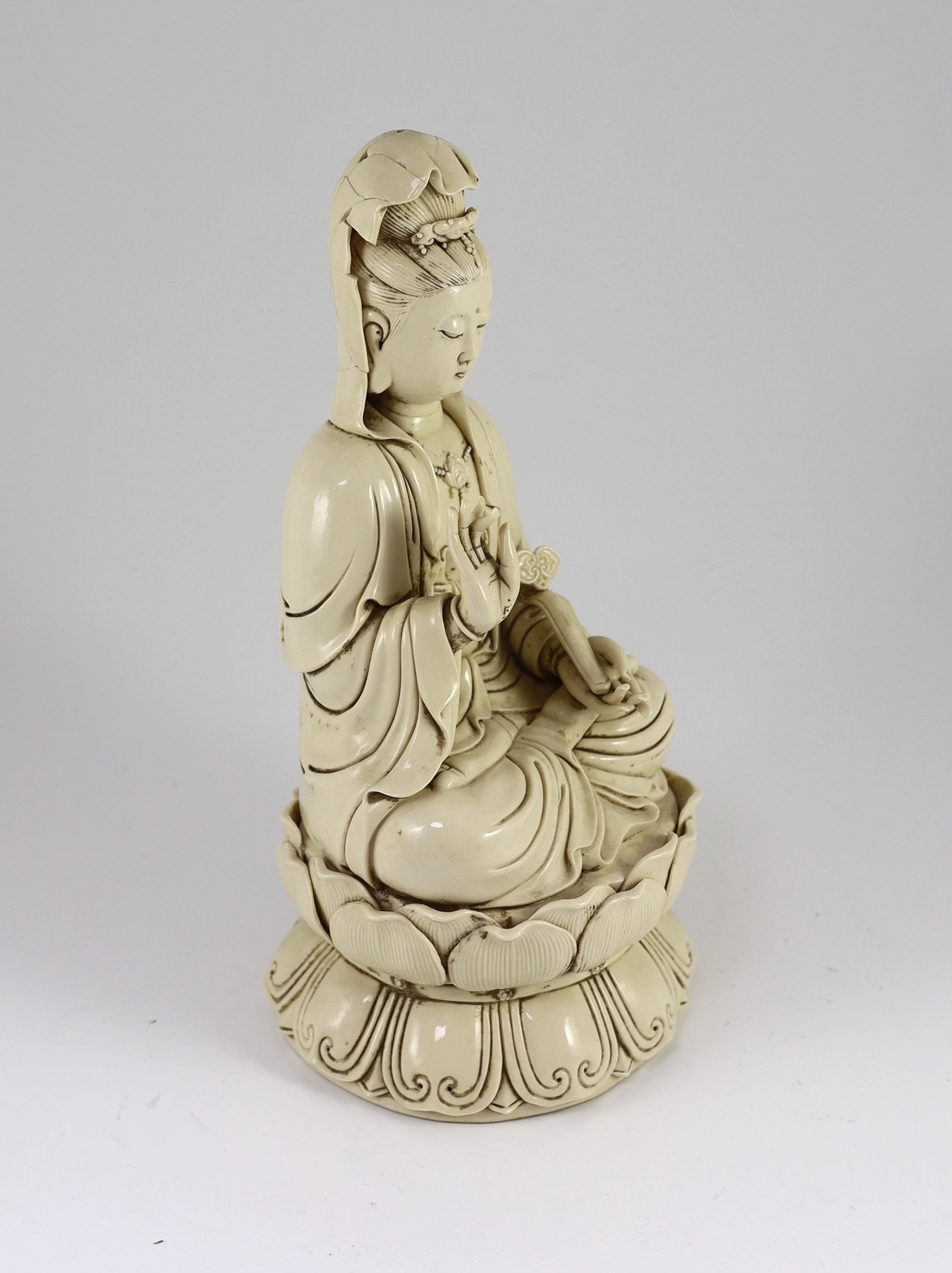 A large Chinese blanc-de-chine figure of Guanyin, Boji Yuren mark, 19th century or later, 36.5 cm high, back of head broken and re-glued